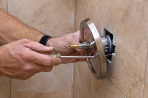 Aurora plumbing contractor installs a shower control and cover plate